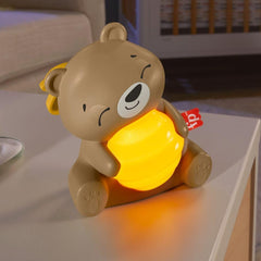 Fisher-Price Beary soothing sound machine shown in travel setup with honeybee link for on-the-go comfort.