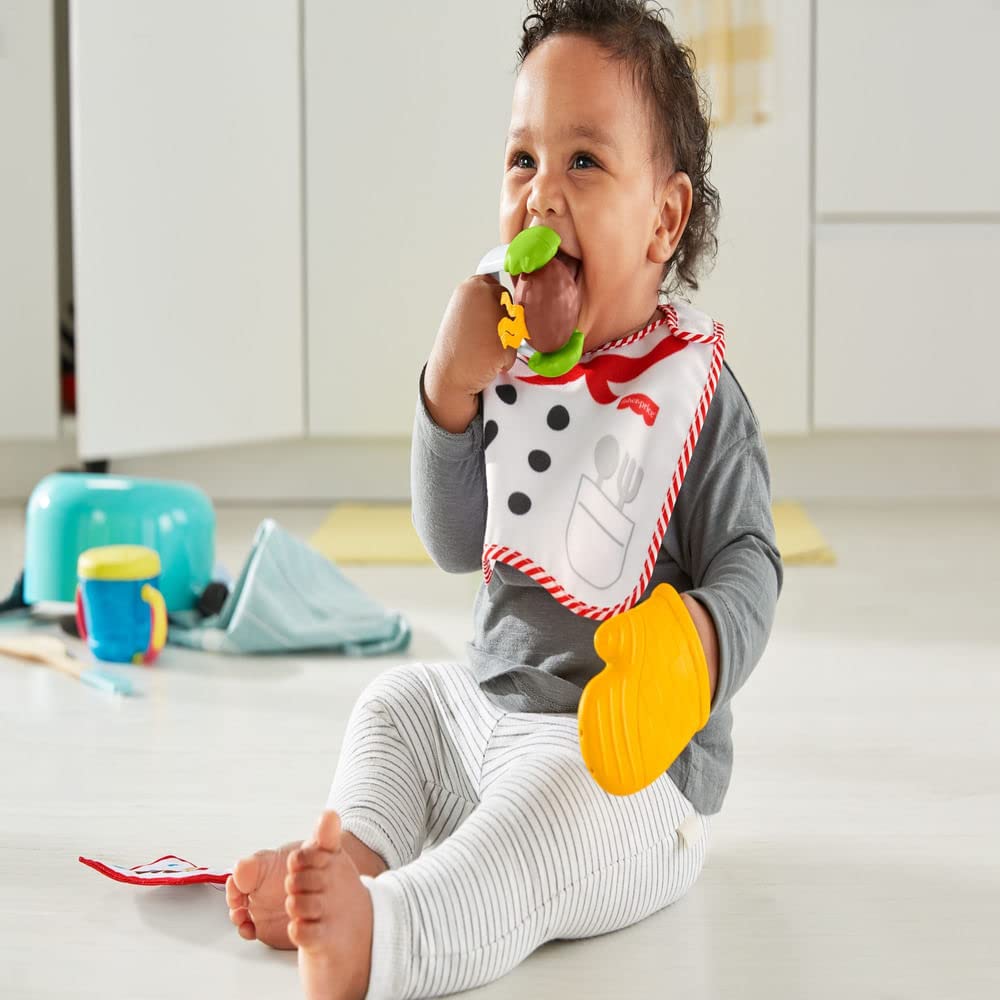 Fisher-Price Cutest Chef oven mitt teether designed for soothing gums during meals.