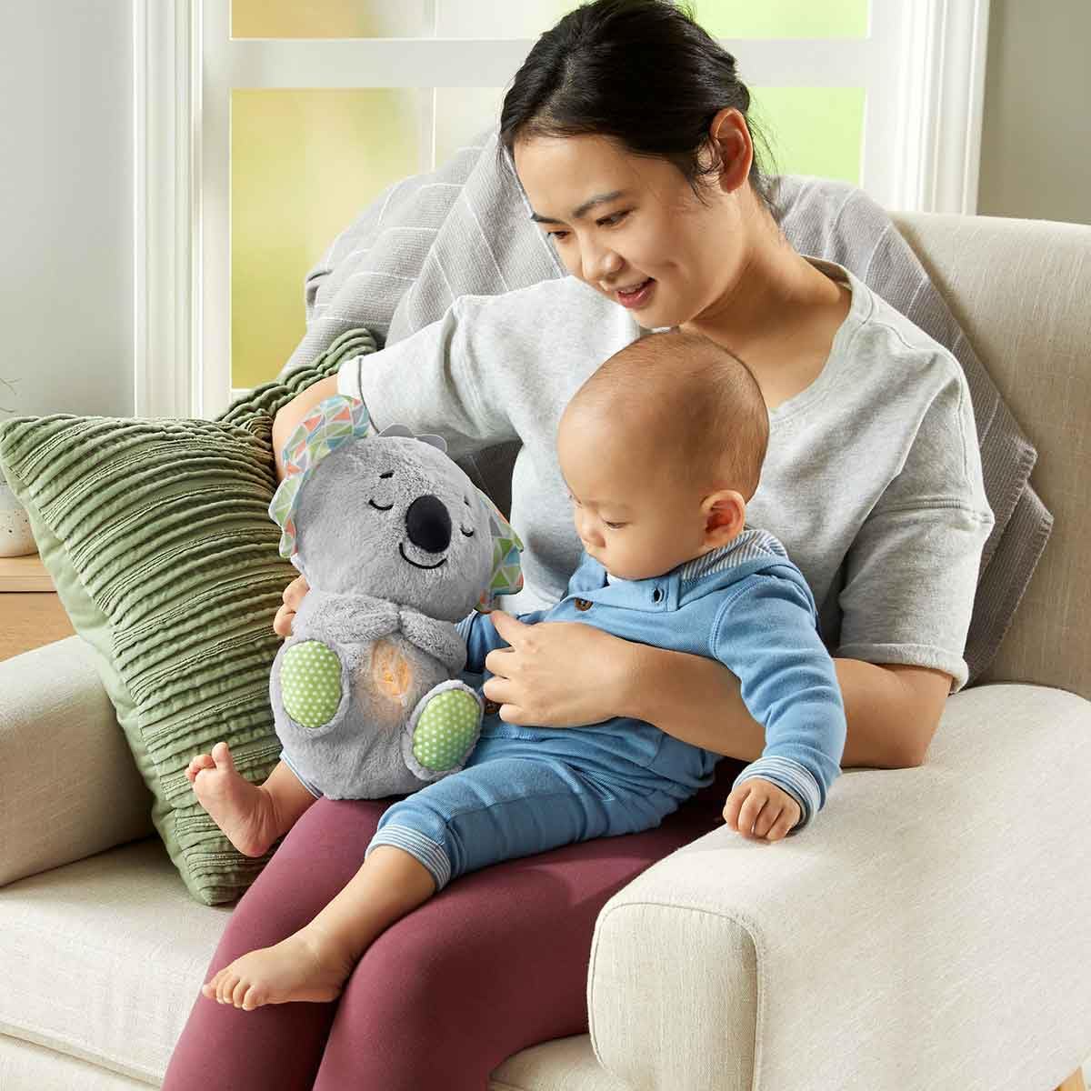 Fisher-Price Koala plush face close-up with satiny ears for cozy sensory exploration.