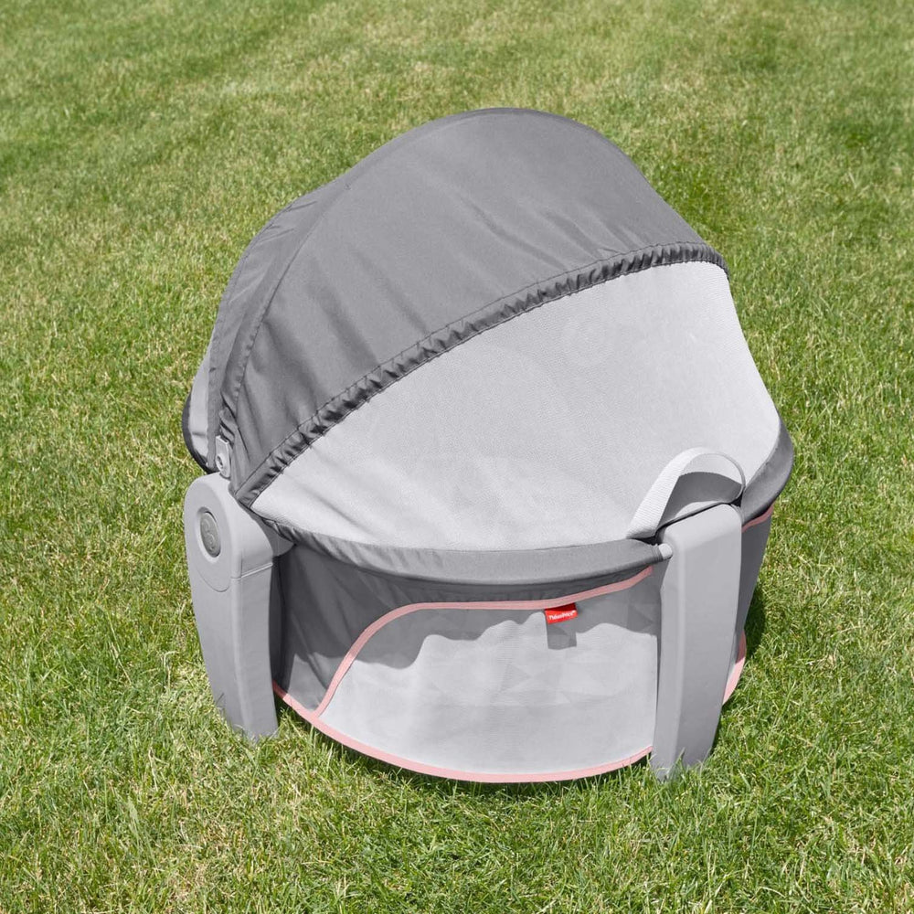 Fisher-Price portable bassinet overhead toys promote eye tracking and focus.