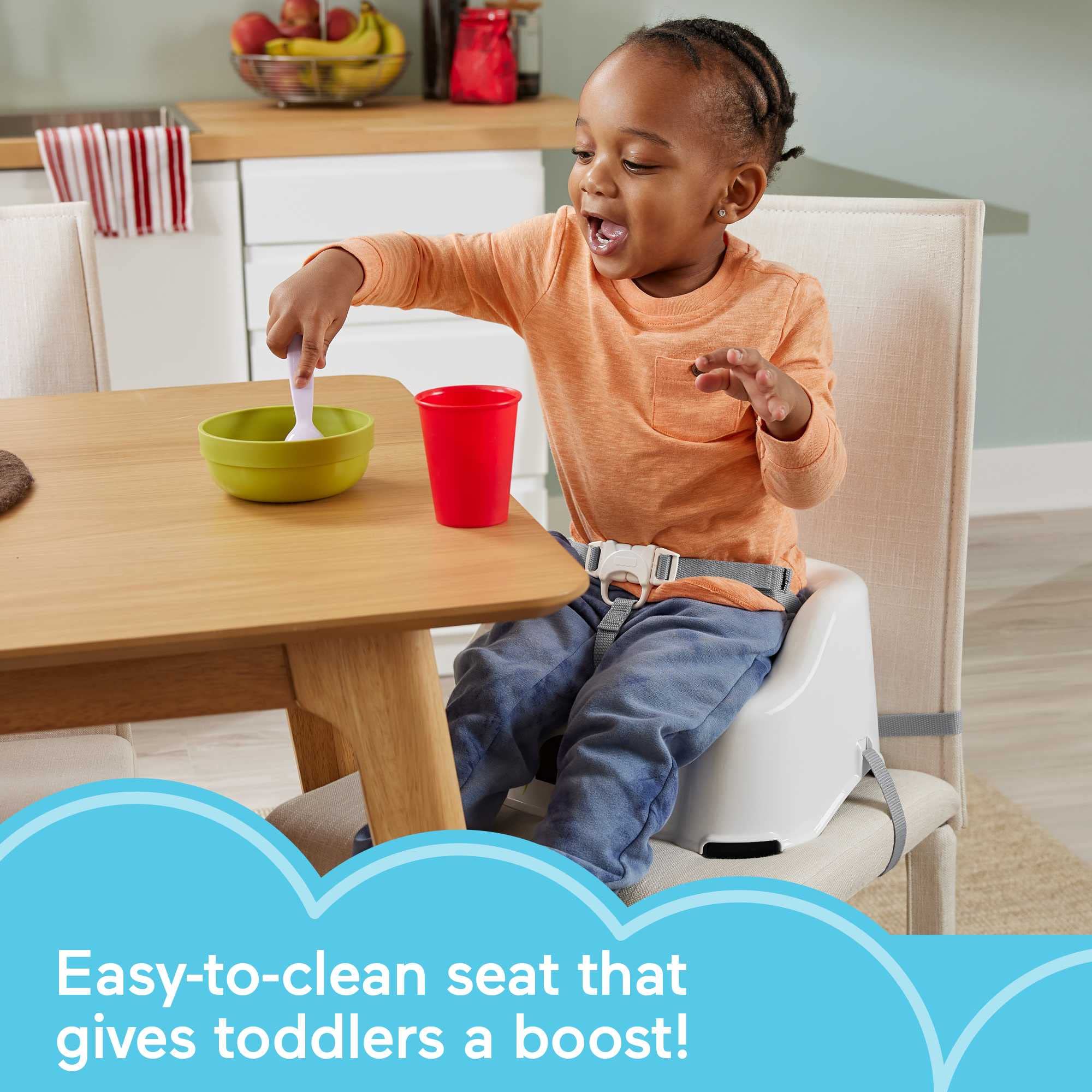 Fisher-Price Simple Clean and Comfort booster seat attached to chair for secure dining