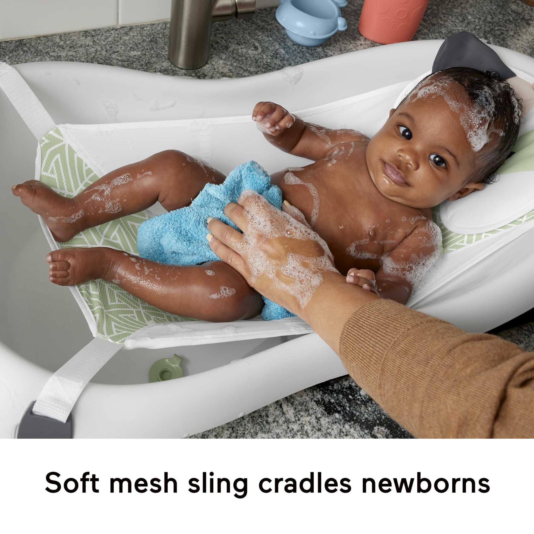Fisher-Price toddler tub with rinse scoop offers room to splash.