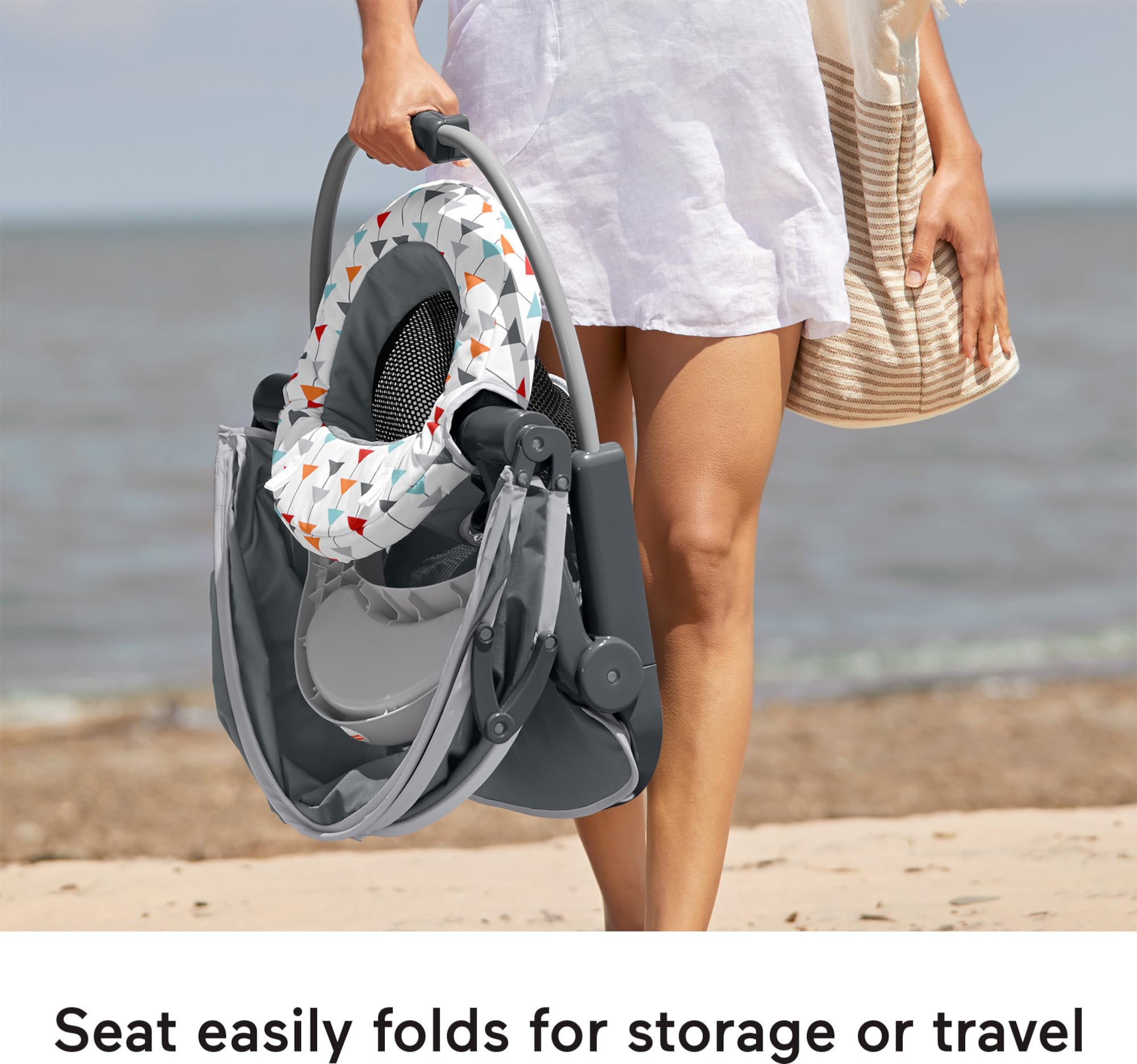 Fisher-Price Travel Baby Chair removable seat pad simplifies cleaning after meals.