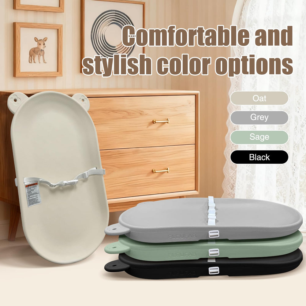 FLEUFAB changing pad with secure belt during diaper change highlights safety-focused design