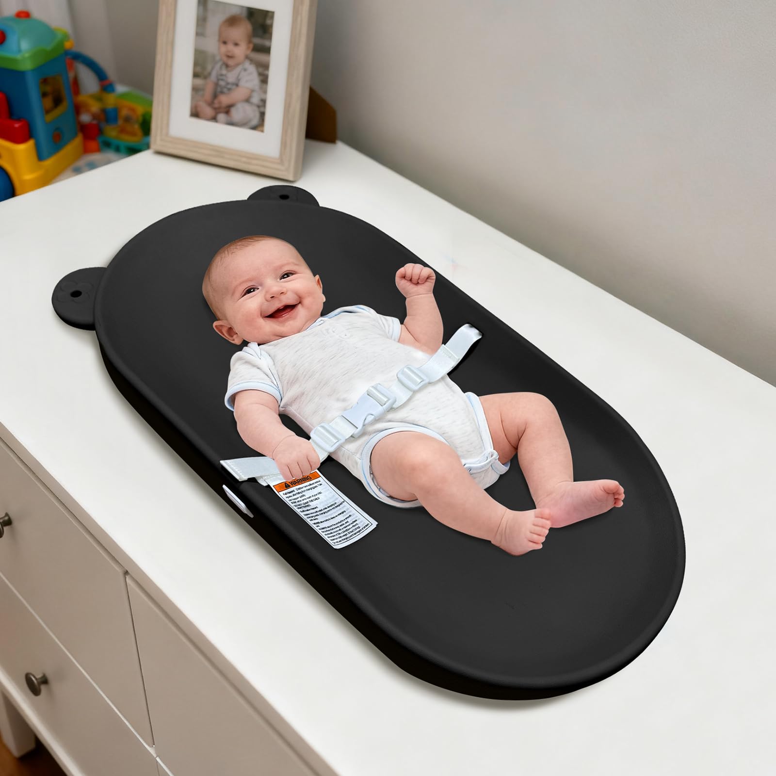 FLEUFAB changing pad black outer view showing secure belt for safe diaper changes