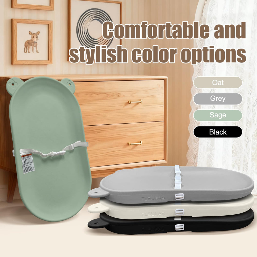 FLEUFAB nursery green changing pad blends with decor while providing comfort