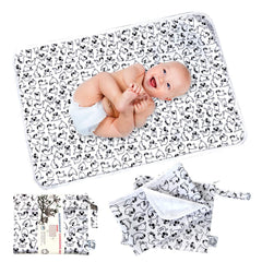FLOCK THREE waterproof changing pad laid flat for quick diaper changes anywhere.