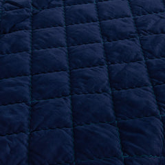 FLXXIE comforter stroller-use scene shows lightweight fabric for easy on-the-go cuddles.