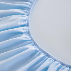 FLXXIE fitted-sheet closeup demonstrates snug fit and year-round softness