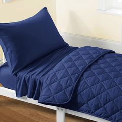 FLXXIE toddler bedding navy blue quilt closeup highlighting soft microfiber comfort for quiet nights.