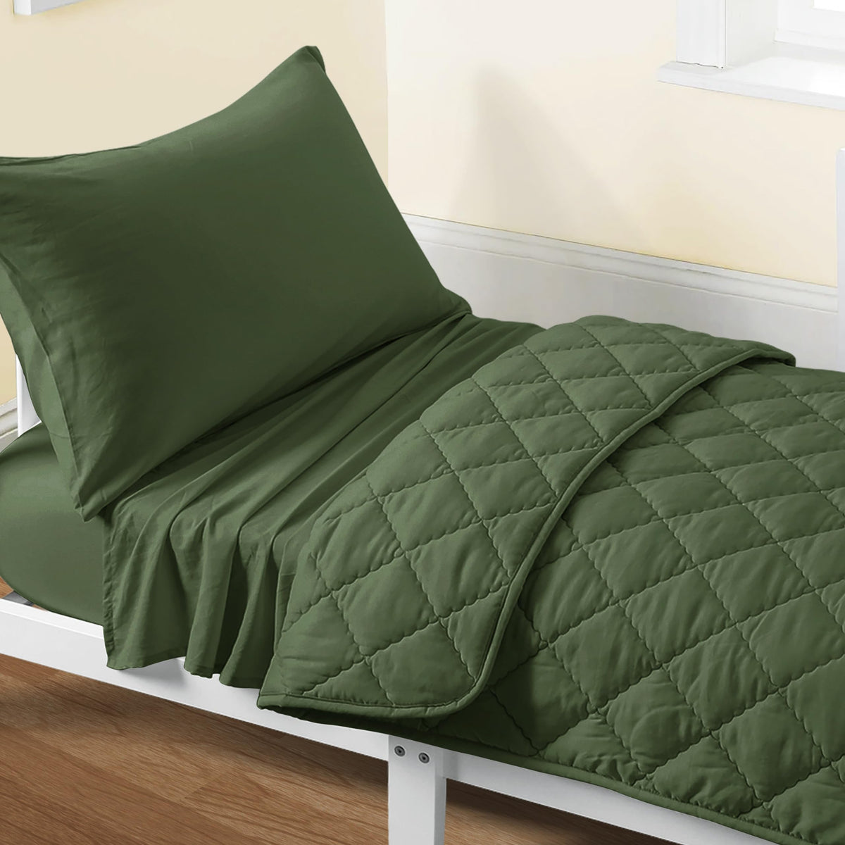 FLXXIE toddler olive quilt close-up showing soft microfiber stitching for durable comfort