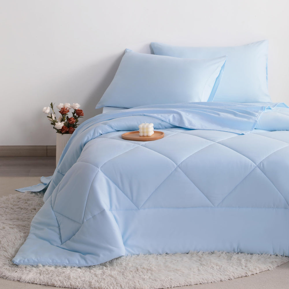 FLXXIE toddler bedding room-scene with coordinated aqua palette