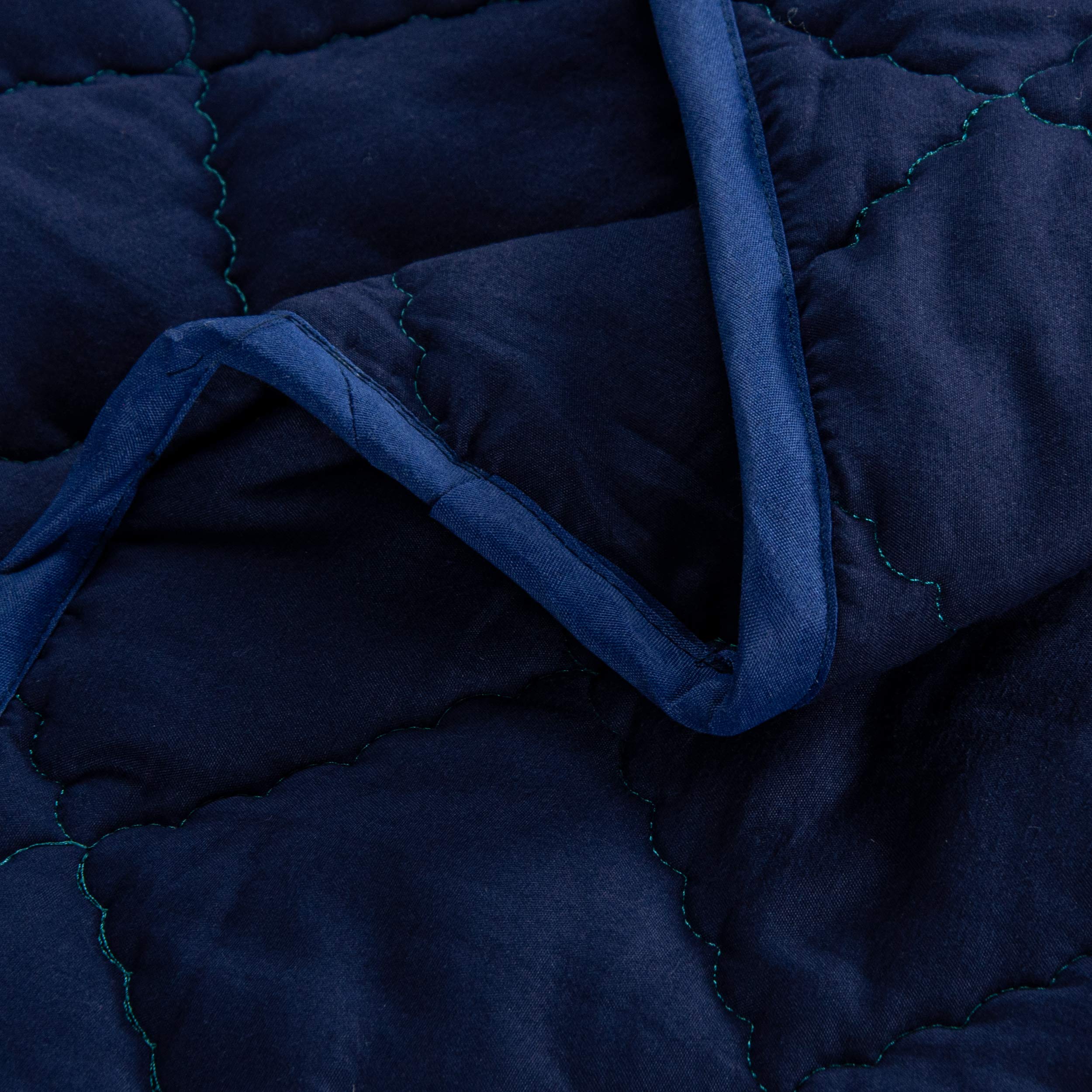 FLXXIE toddler comforter navy snuggle closeup emphasizes gentle warmth and kid-friendly feel.