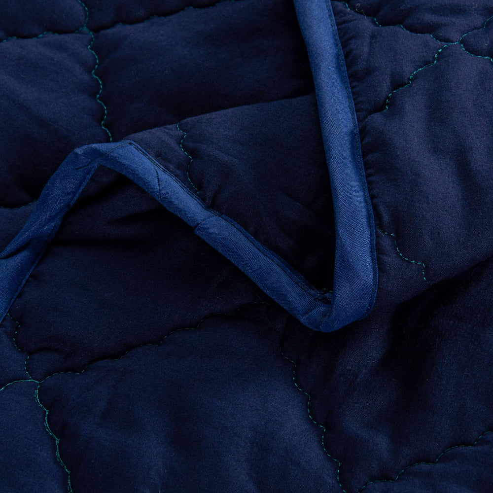 FLXXIE toddler comforter navy snuggle closeup emphasizes gentle warmth and kid-friendly feel.