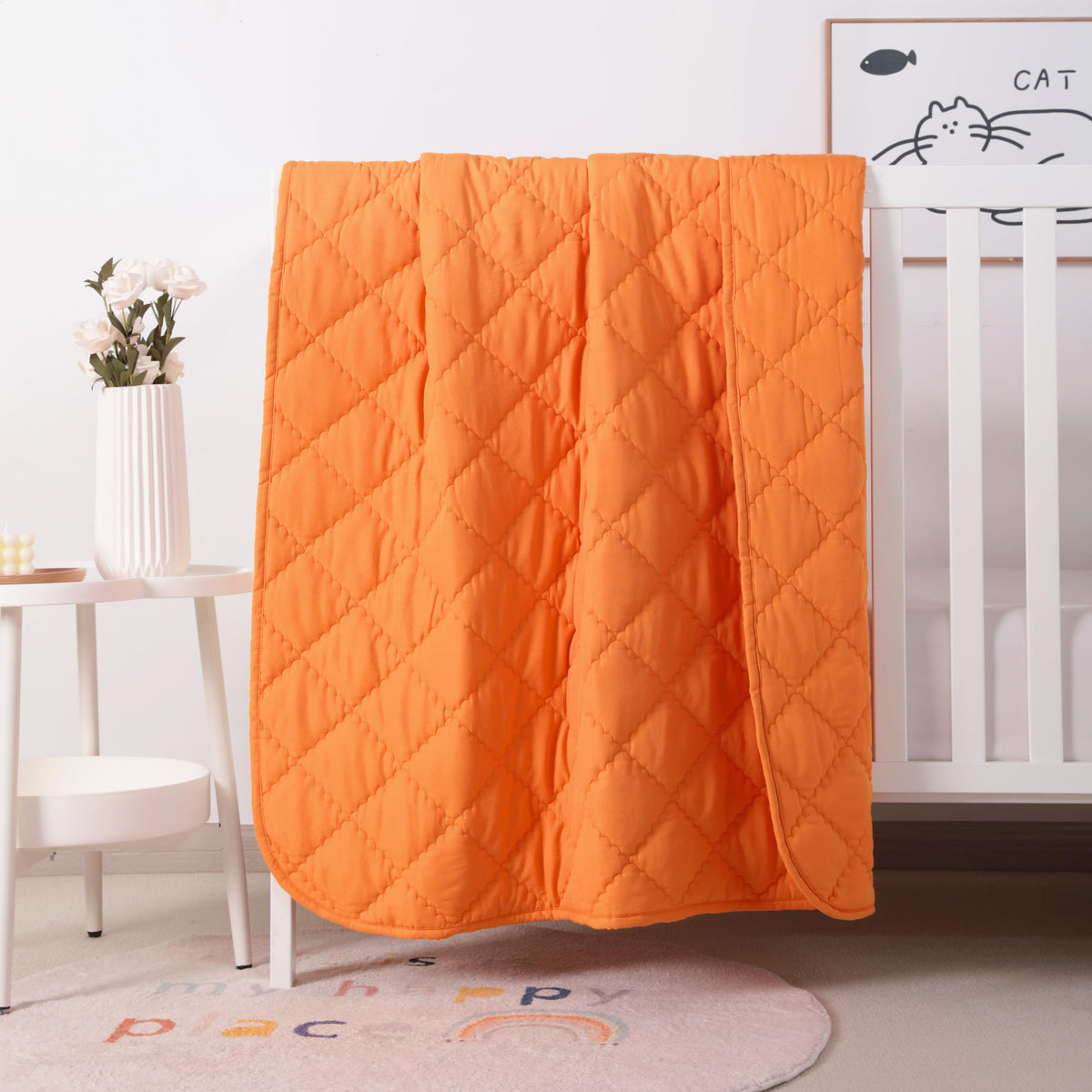 FLXXIE toddler comforter orange folded—travel-friendly warmth