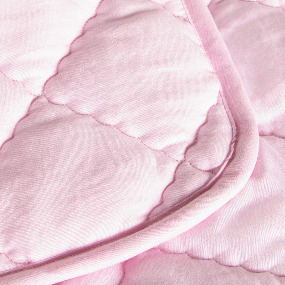 FLXXIE Toddler Comforter pink folded demonstrates easy storage and quick travel-ready warmth.
