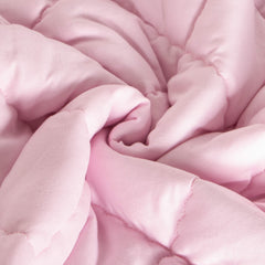 FLXXIE Toddler Comforter pink in stroller use highlights portable comfort during car rides.