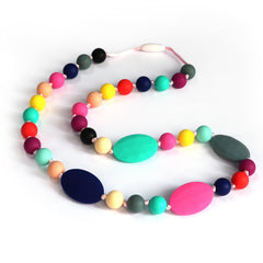 Flyaway chew necklace safety material close-up highlights BPA-free silicone for safe sensory use.