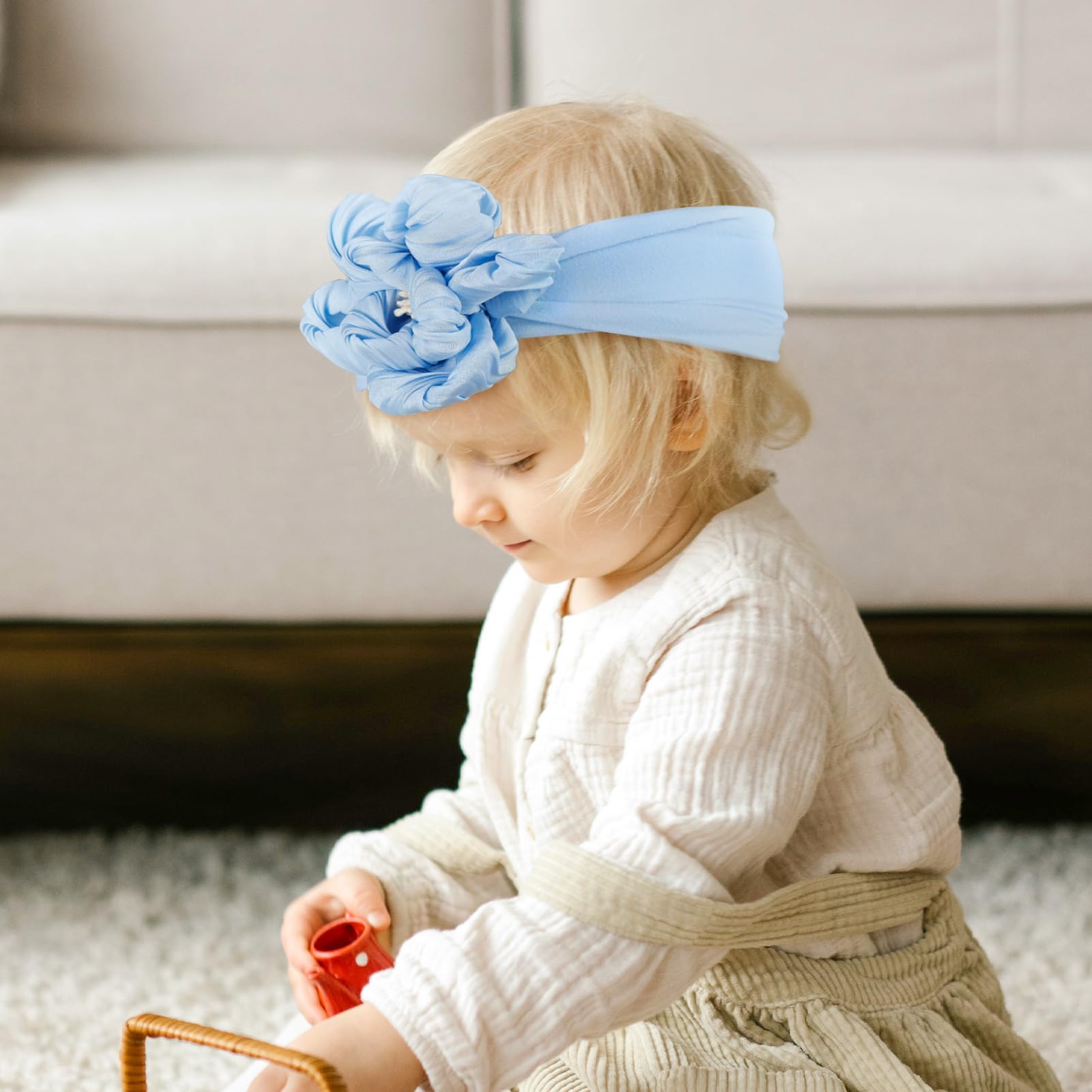 Fmeida headband blue flower showcased as a gift option for baby showers.