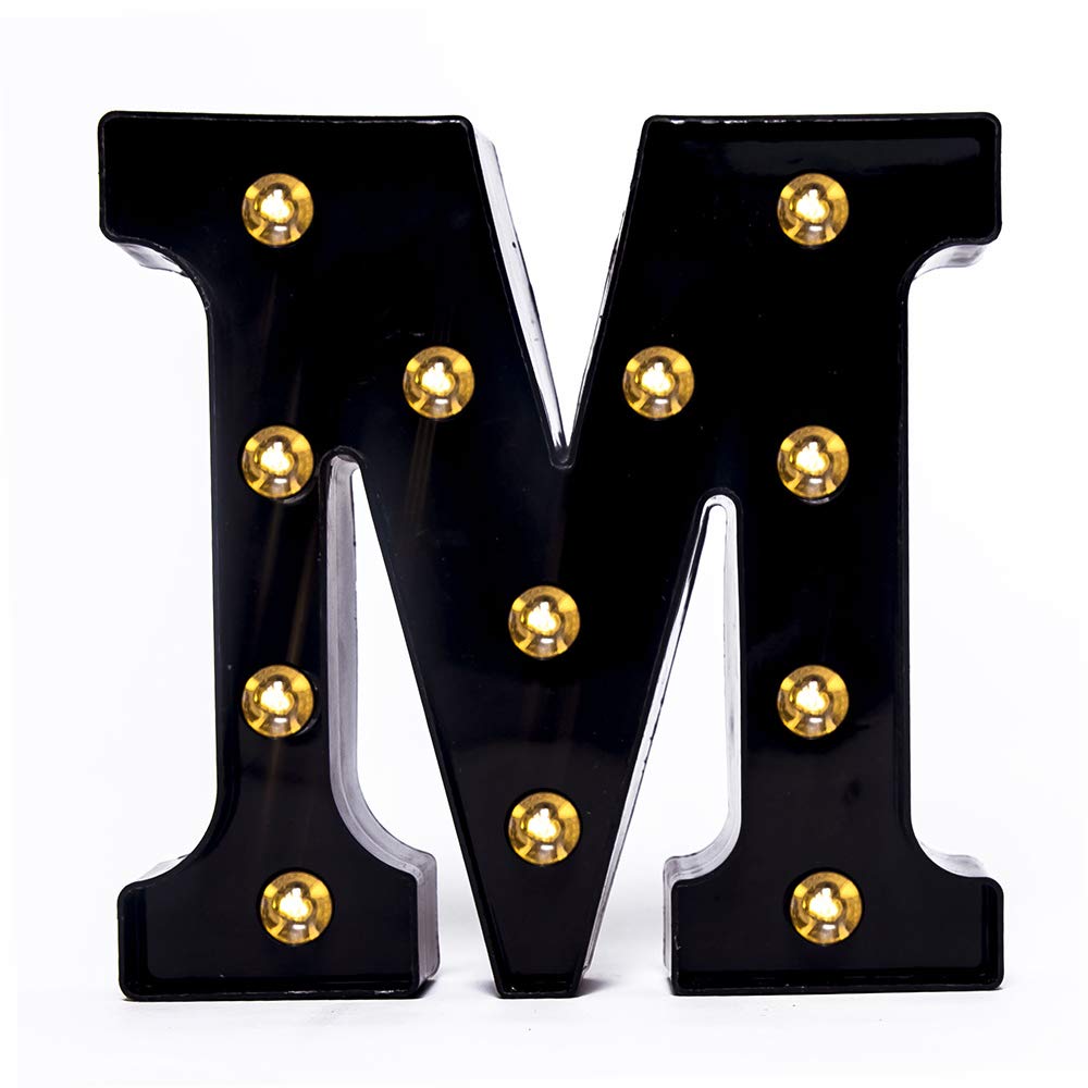 Foaky black LED marquee number lights sign mounted on wall with warm glow