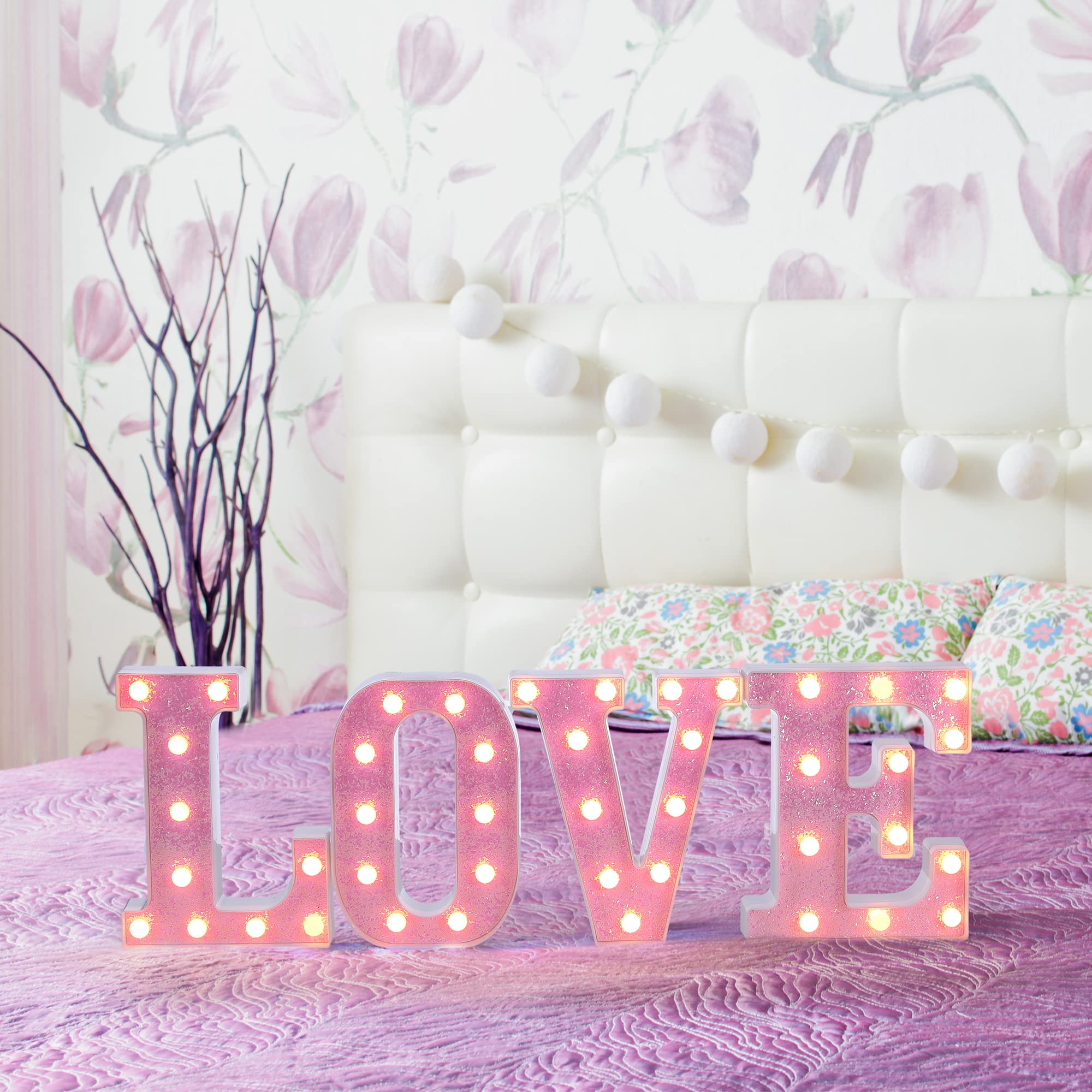 Foaky pink letters on a reception table add shine to events.