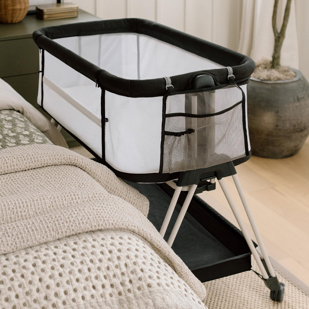 Fodoss room setup with bedside bassinet ready for nighttime caregiving.
