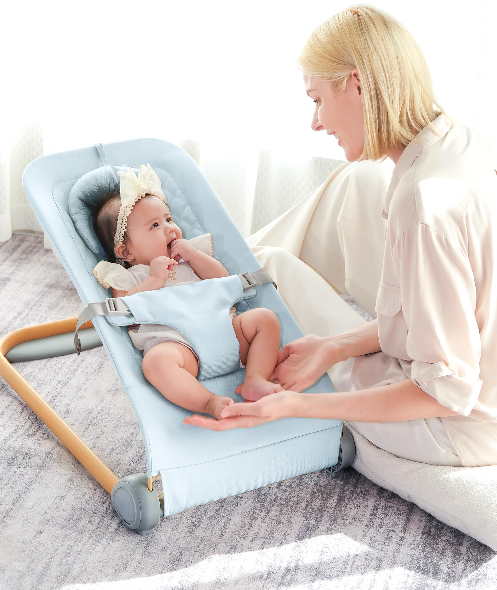 Fodoss Baby Bouncer wheels blue demonstrates smooth movement.