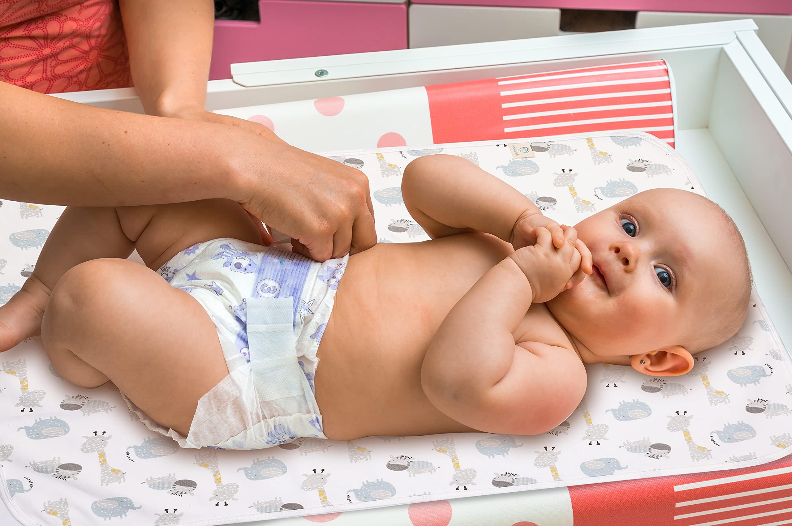 FOOK FISH baby changing pad liner folded pack demonstrates portable, travel-friendly design for on-the-go changes