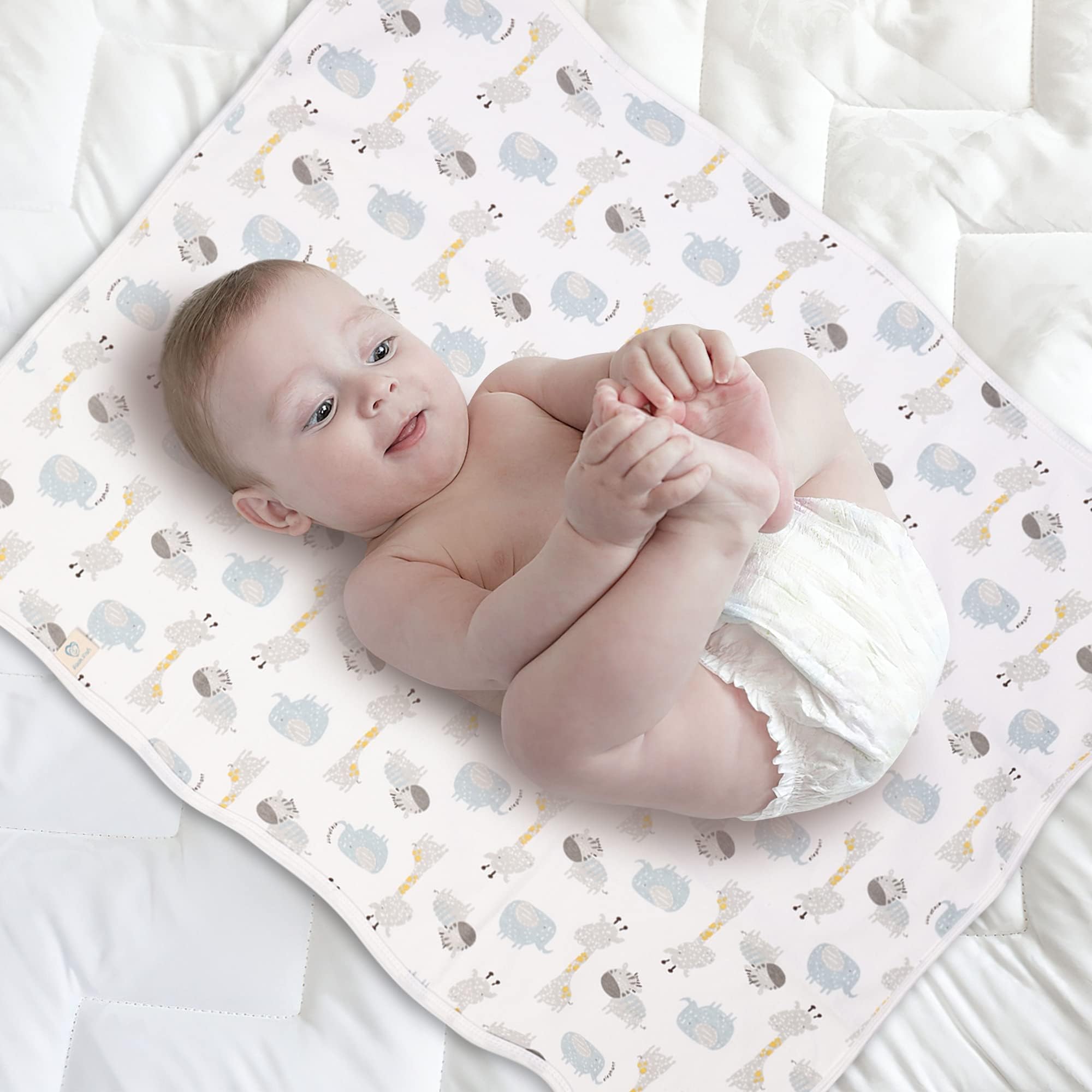 FOOK FISH reusable underpad protects baby surfaces during trips.