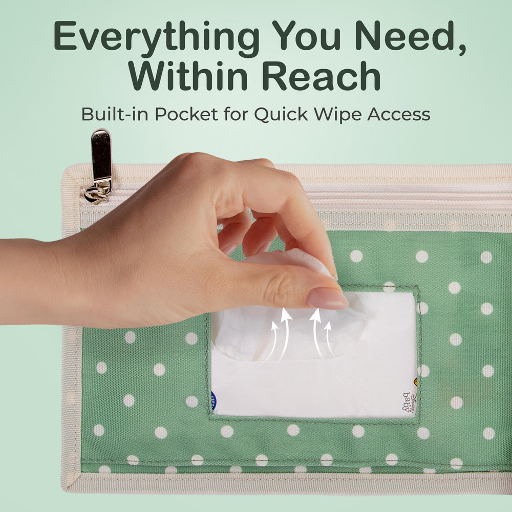 Four Cuddles changing pad shows wipes pocket for quick on-the-go access.