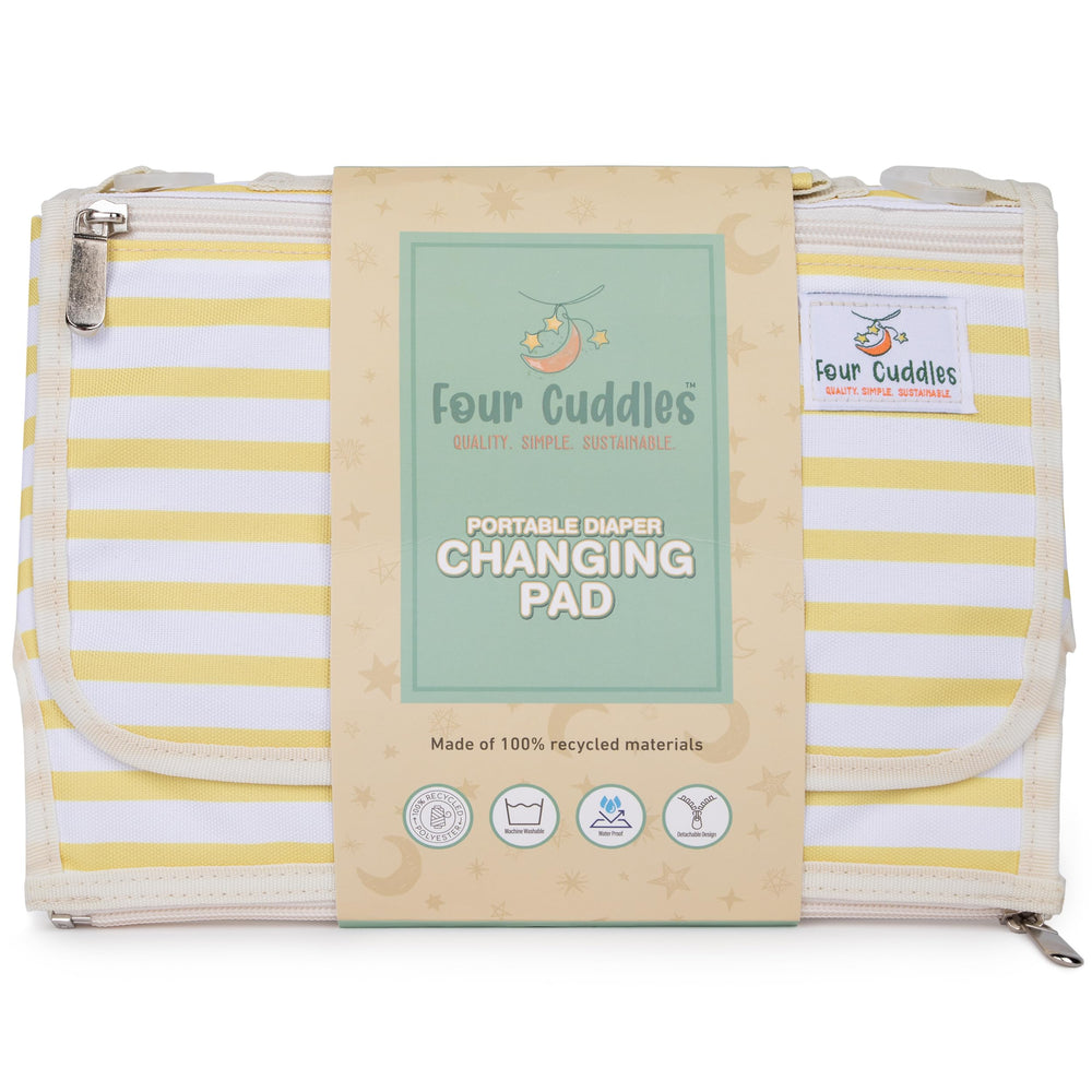 Four Cuddles portable diaper changing pad head-support cushions baby's head during changes.