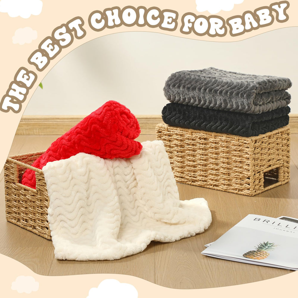 Frienda baby blanket in crib scene red-black shows cozy nursery use.