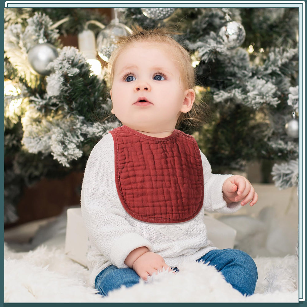 Frienda muslin bibs snaps and trim detail illustrate secure fit.