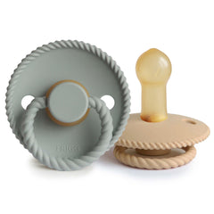 Frigg rope natural rubber pacifier in Sage with entwined rope around the shield for gentle support
