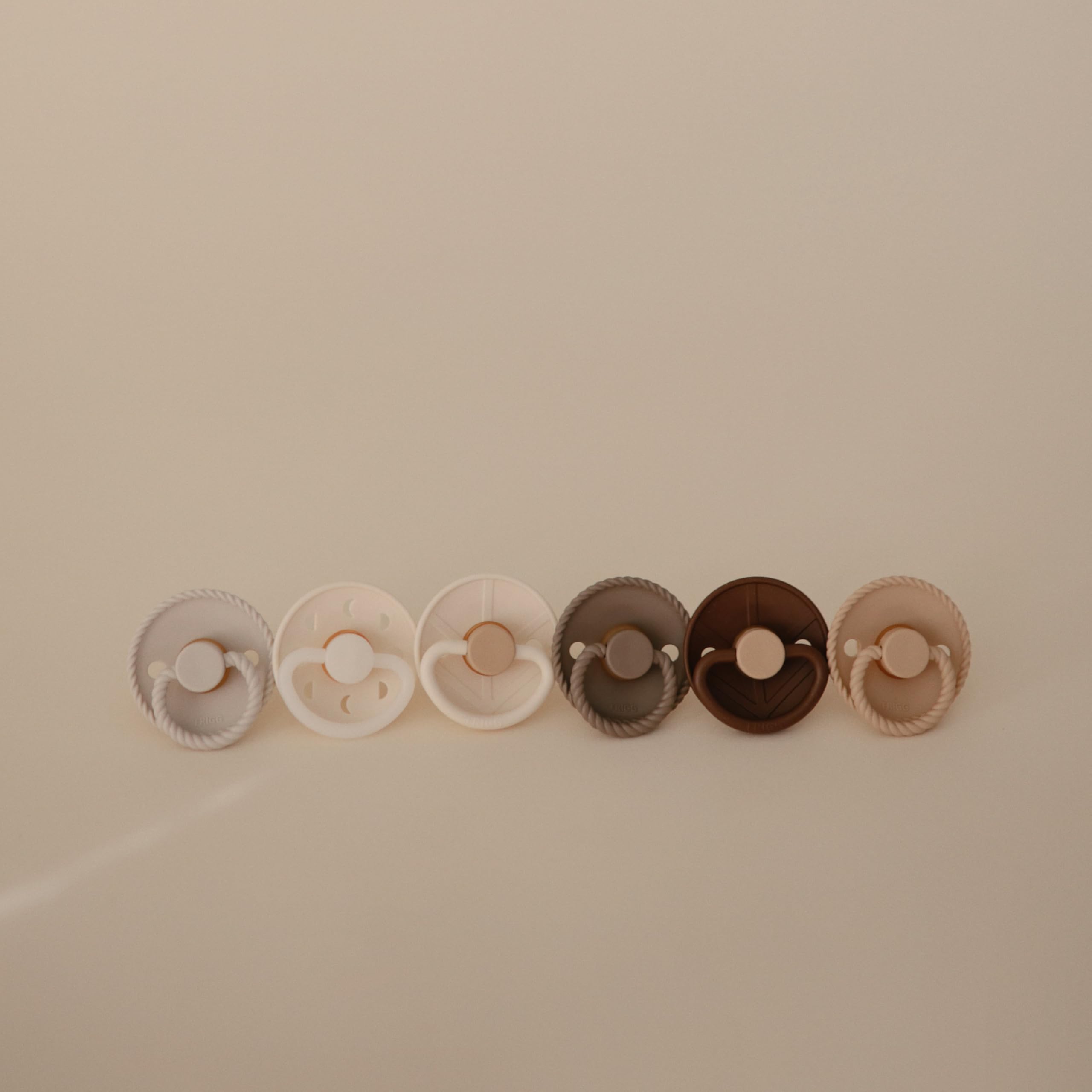 FRIGG SilkySoft pacifier outward-curve design keeps nipple off baby's skin for comfort.