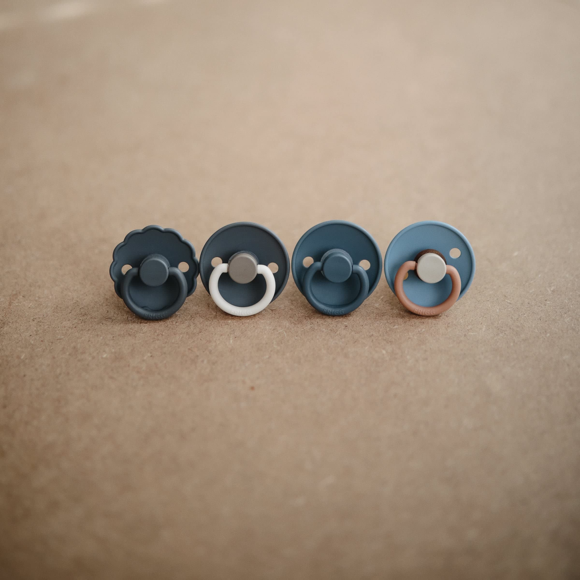 FRIGG Daisy SilkySoft pacifier security handle keeps it handy and secure.