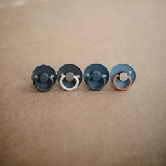 FRIGG Daisy SilkySoft pacifier security handle keeps it handy and secure.
