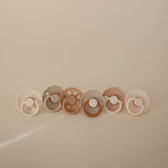 FRIGG SilkySoft pacifier with air holes and security handle for safe, breathable use