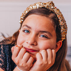 FROG SAC sequin knot headband gold side view shows iridescent sequins for versatile style.