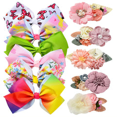 Fsmiling hair bows with red flowers on an alligator clip for secure ponytail styling.