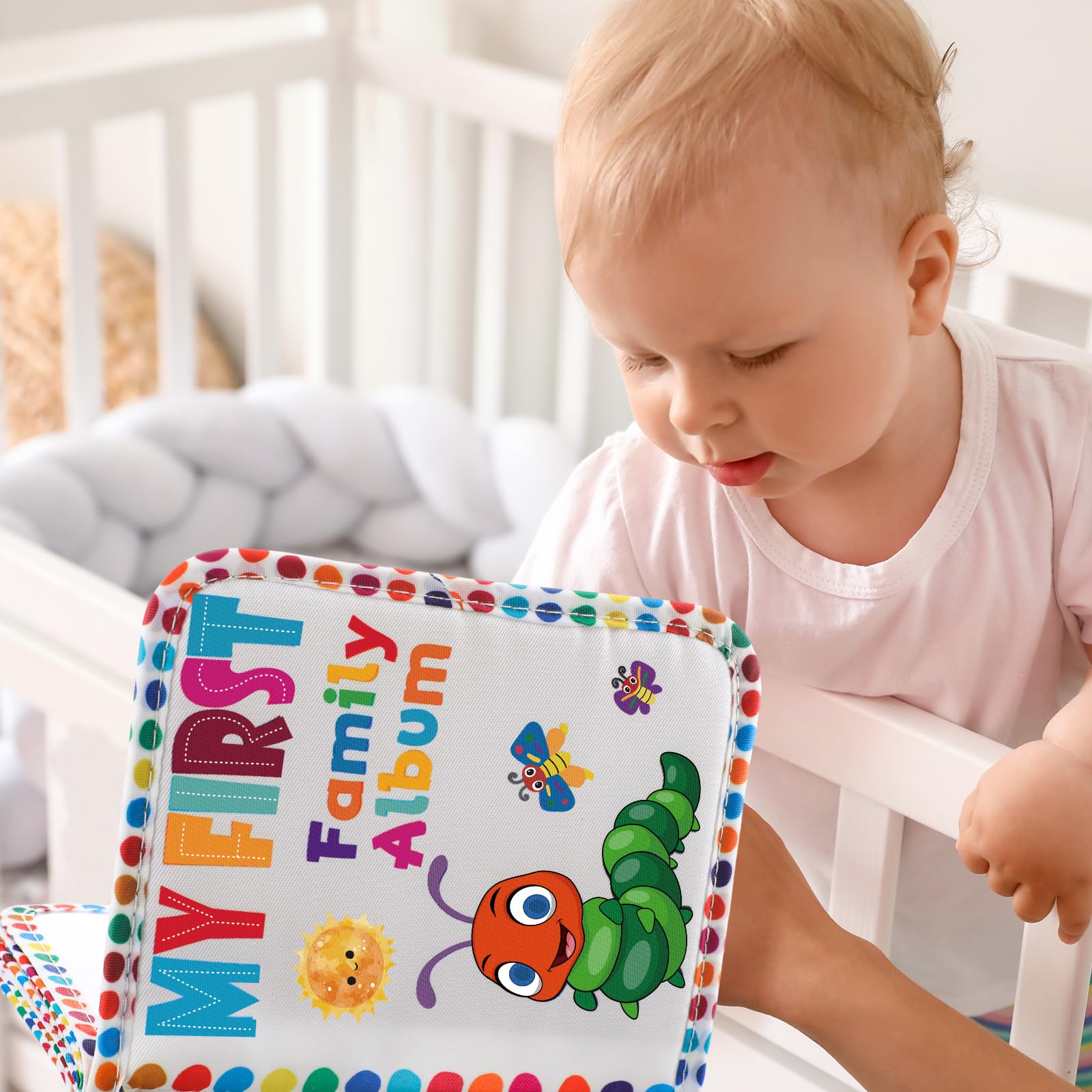 Fullhawl My First Family Album teether-ring attachment enables crib or stroller access.