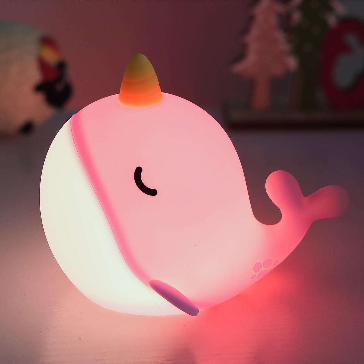 Fuloon Narwhal night light pink tap-control closeup—gentle glow for bedtime routines.