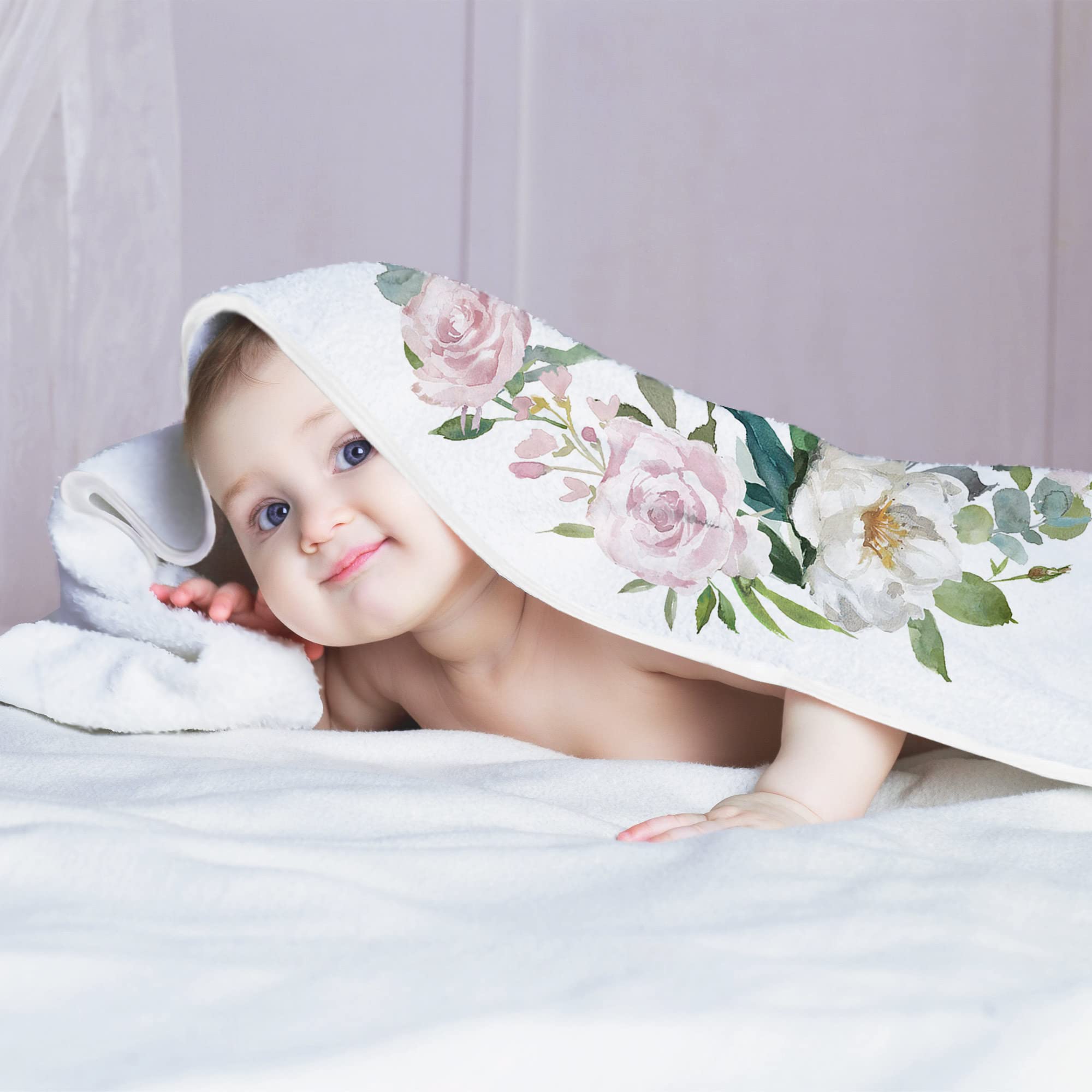 Fundich rose-themed blanket doubles as a versatile backdrop for monthly updates.
