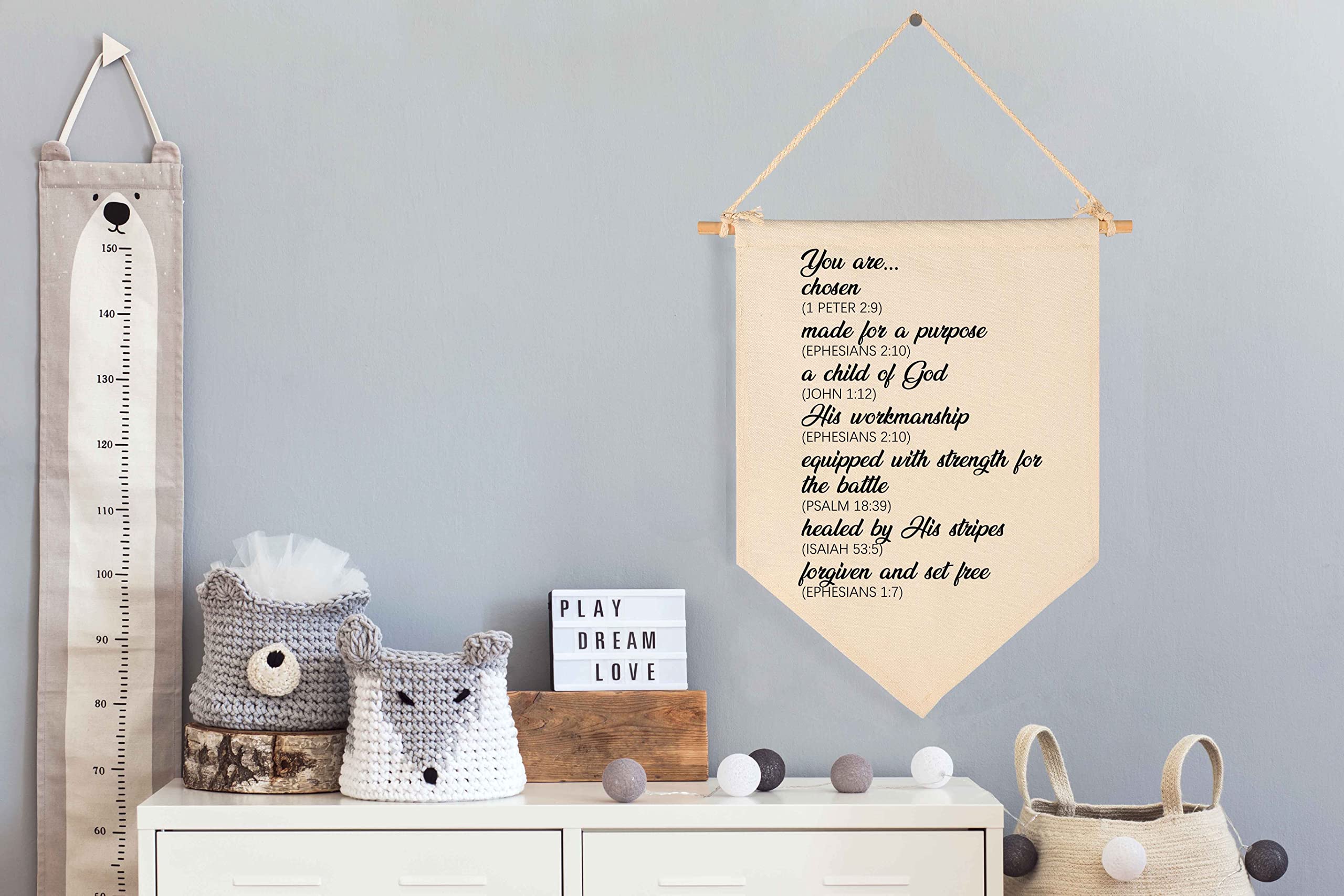 FYSIA beige pennant banner in nursery wall decor, creates a warm, welcoming space.