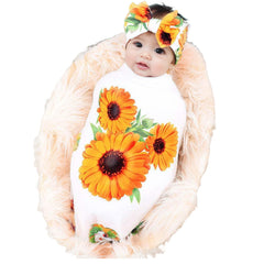 Galabloomer newborn blanket with rose bow on white sunflower print for cozy swaddling