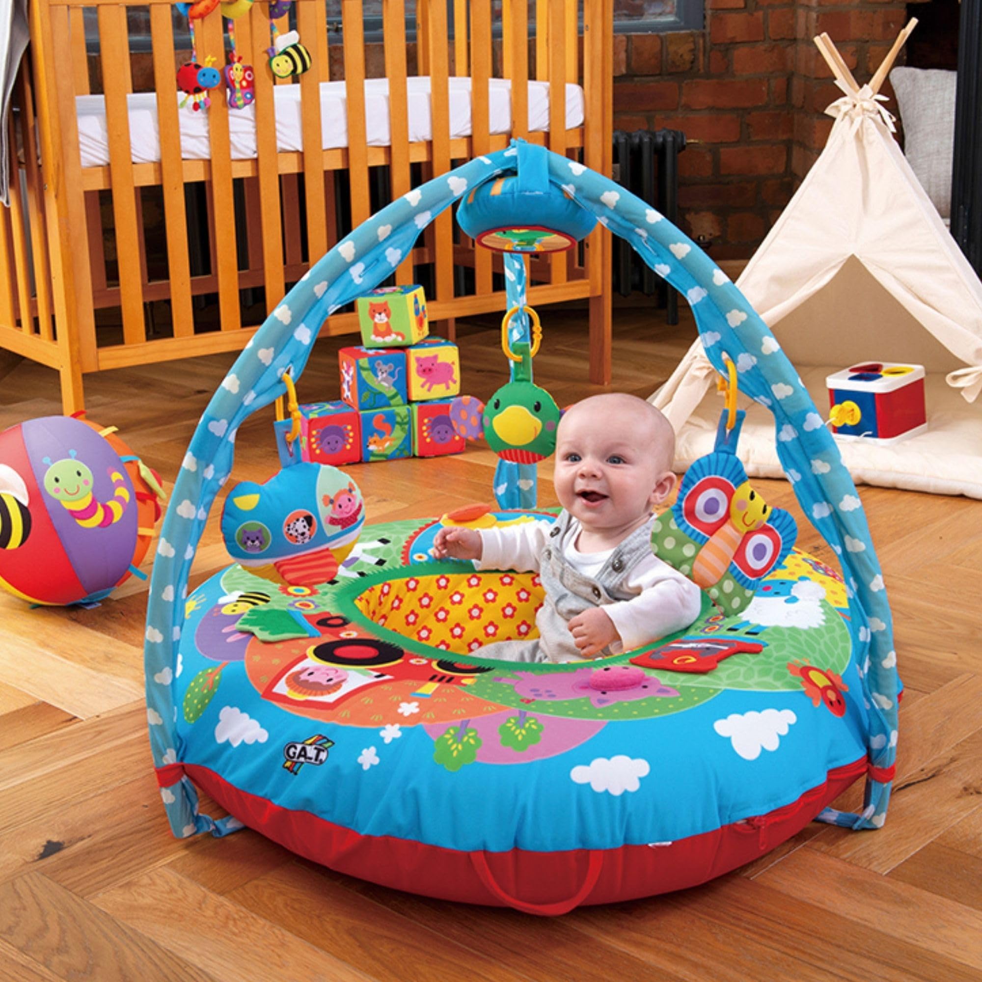 Galt Playnest Gym baby playing with toys during tummy-time and play