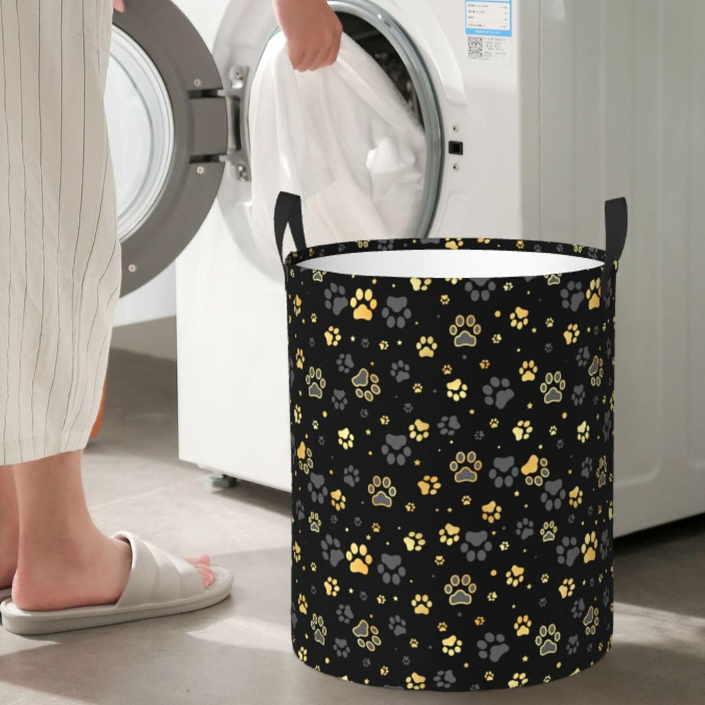 Gbuzozie Golden Dogs round laundry hamper storing toys and kids items.