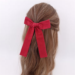 Gebelle 5-inch Fable bow in scarlet adds playful detail.