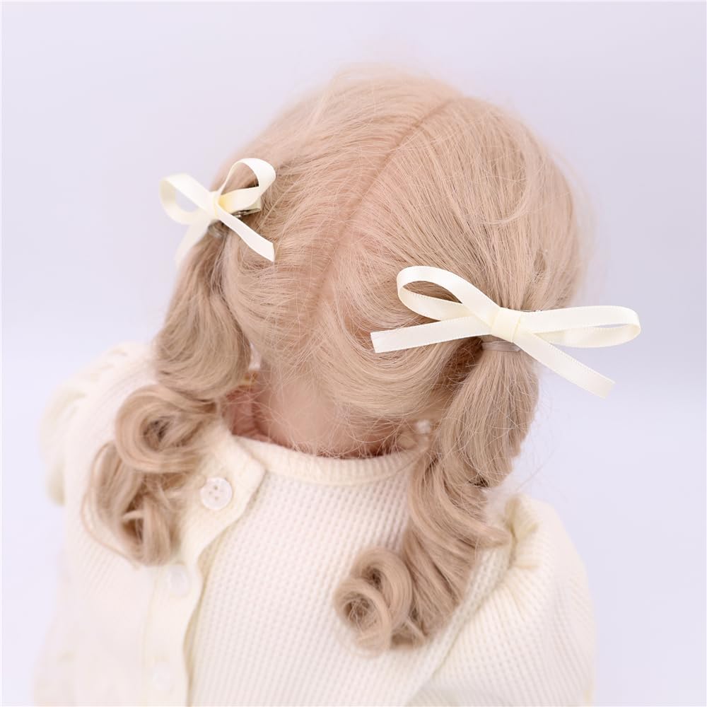 Gebelle tiny satin bow clip side view shows secure wrapped grip for kids.