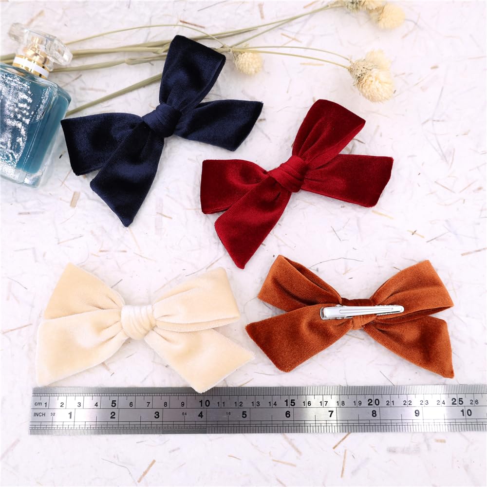 Gebelle Velvet Bow Hair Clip shown on a baby outfit for gift-ready charm.